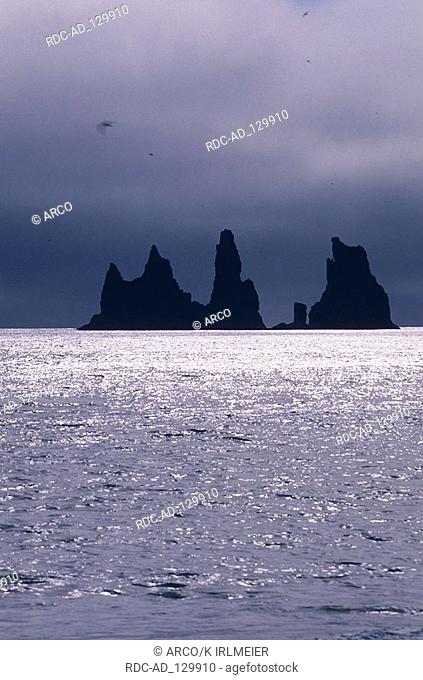 Rocks in the sea Reynisfjara peninsula Dyrholaey Iceland