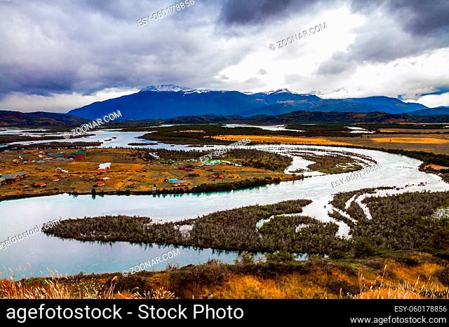 Serrano River Valley. The amazing park of Torres del Paine. Shallow river with glacial melt water. Extreme travel to Patagonia