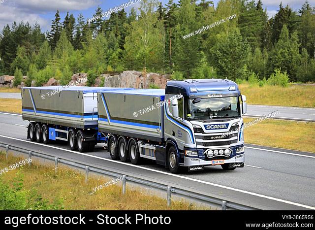 Beautifully customised Scania R730 grain truck with hopper trailer Poysti Trans at speed on motorway in the summer. Salo, Finland. July 23, 2021