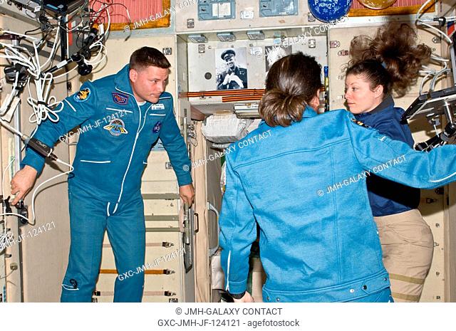 NASA astronauts Doug Wheelock, Shannon Walker (foreground) and Tracy Caldwell Dyson, all Expedition 24 flight engineers, are pictured in the Zvezda Service...
