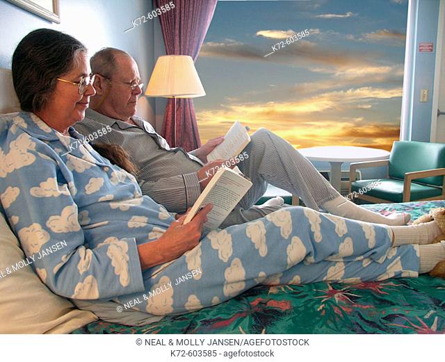 Older Couple Lounging Together on Bed