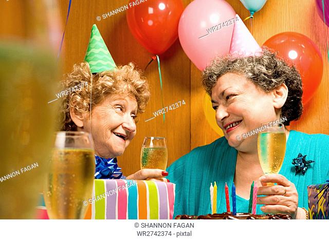 Two senior women at a party