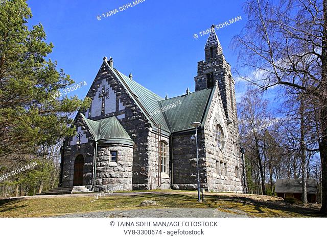 Karuna Church and bell tower in Karuna, Sauvo, South of Finland in spring. The church was built in 1908-10 in the style of Finnish National Romanticism