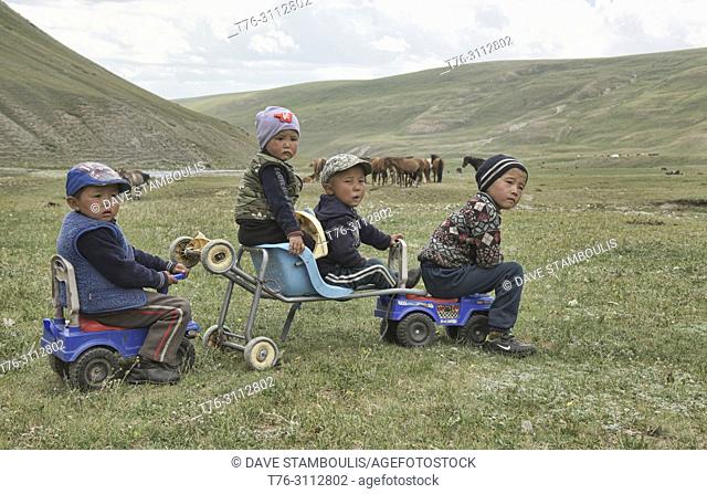 Nomadic boys playing on the plains, Sary Mogul, Kygyzstan
