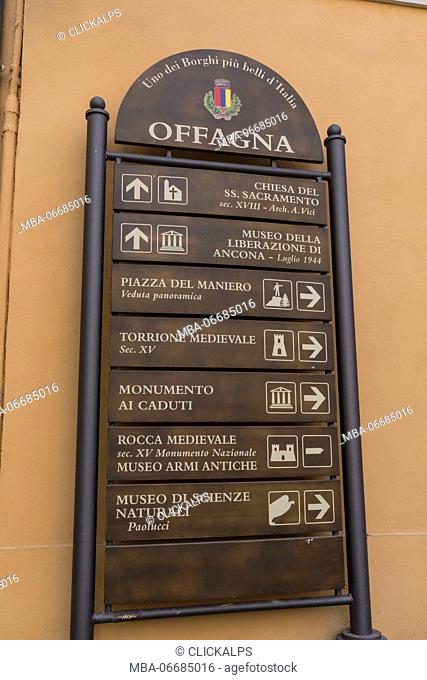 Tourist signs in the typical alley of the medieval village perched on the hill Offagna Province of Ancona Marche italy Europe