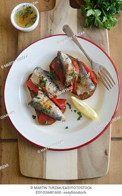 Sardines with roasted red peppers on toast
