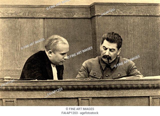 Joseph Stalin and Nikita Khrushchev in the Presidium of the Congress of Soviets. Anonymous . Photograph. 1936. State Museum of History, Moscow