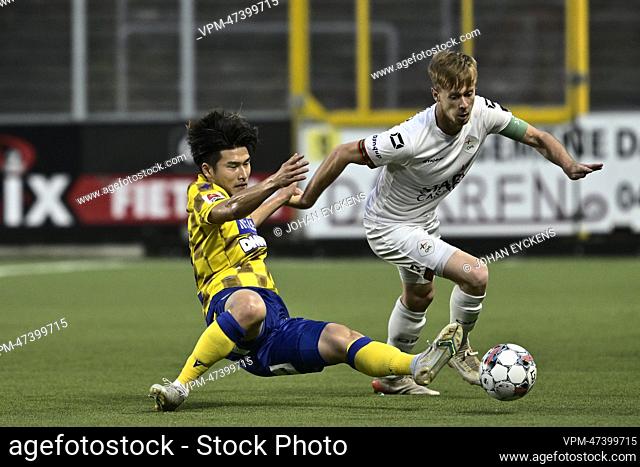 STVV's Daiki Hashioka and OHL's Mathieu Maertens fight for the ball during a soccer match between Sint-Truidense VV and OH Leuven