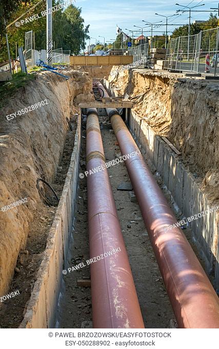Underground pipe installation. Steel, giant. Laying or replacement of underground pipes. Installation of underground pipes. Utility infrastructure