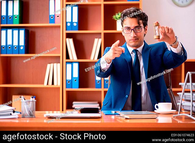 Young handsome businessman working in the office