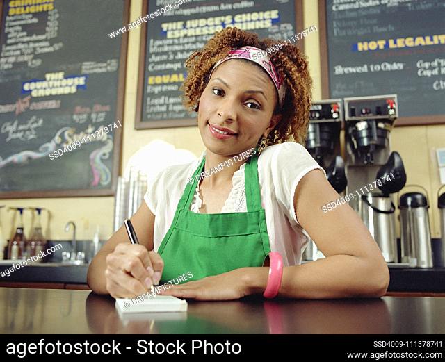Waitress taking order in coffee shop