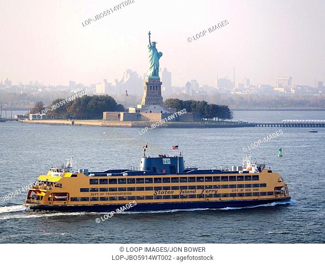 A Staten Island ferry passing the Statue of Liberty