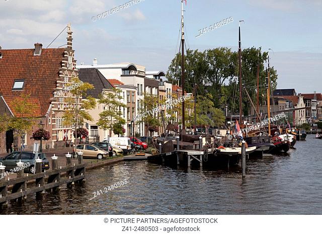 Ships in the historical harbour and the stadstimmerwerf in the city of Leiden, Netherlands