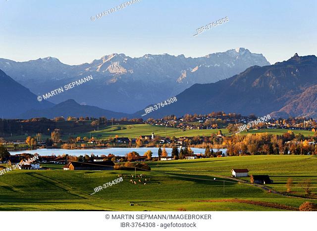 Autumn morning in the foothills of the Alps, view from Mt Aidlinger Hoehe across Riegsee Lake, Froschhausen, Murnau and the Wetterstein Range with Mt Zugspitze