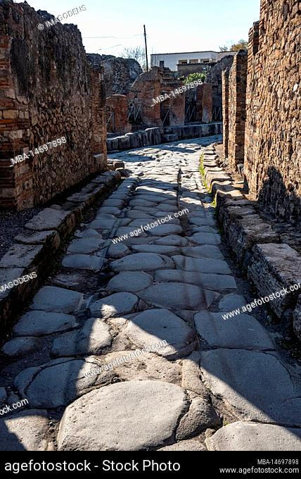 A beautiful typical cobbled street in the ancient city of Pompeii, Southern Italy