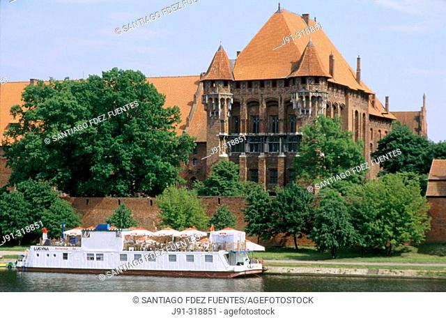 Europe's largest gothic castle (13th century), residence of Teutonic Knights' grand master, beside the Vistula River Delta known as the Nogat. Malbork