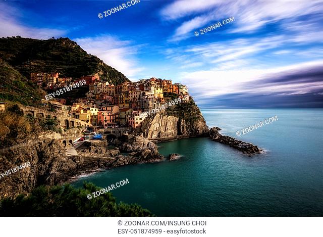 Manarola one of small villages that make up Cinque Terre taken during sunset time on top of the hill