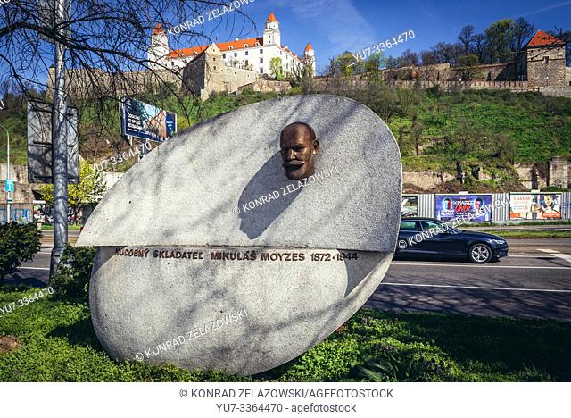 Music composer Mikulas Moyzes monuemtn in Bratislava, Slovakia, view with Bratislava Castle on background