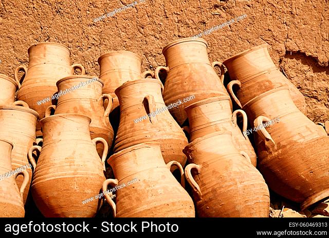 Handmade clay jugs in a pottery workshop