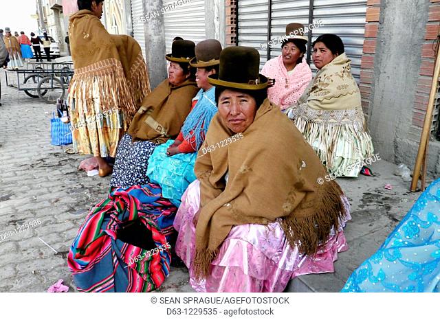 Aymara women during festival, street scene in Achacachi, Bolivia