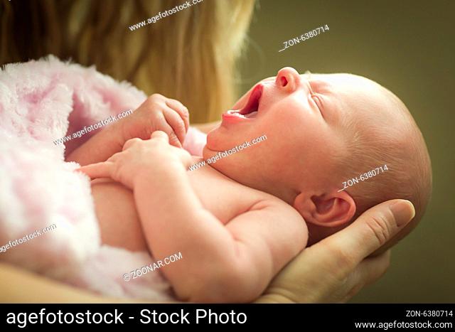 Gentle Hands of Mother Holding Her Precious Newborn Baby Girl