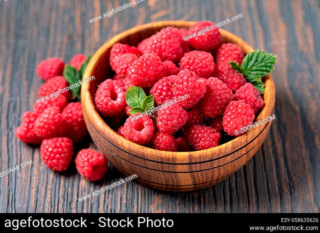 ripe raspberry isolated on a wooden table
