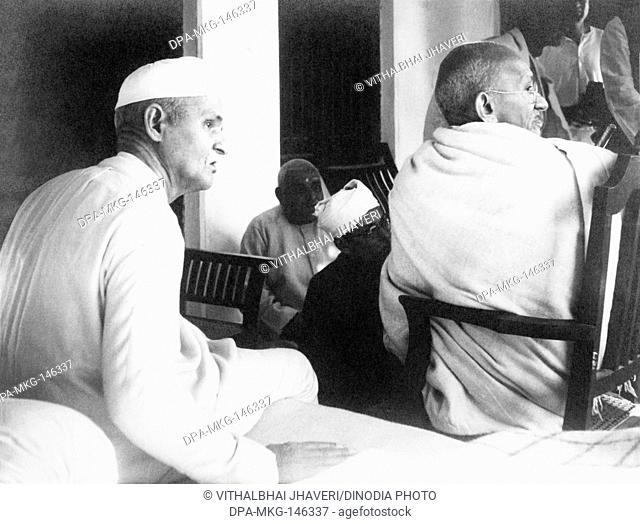 Mahatma Gandhi talking to Madan Mohan Malaviya ; Varanasi ; 1941 ; India NO MR