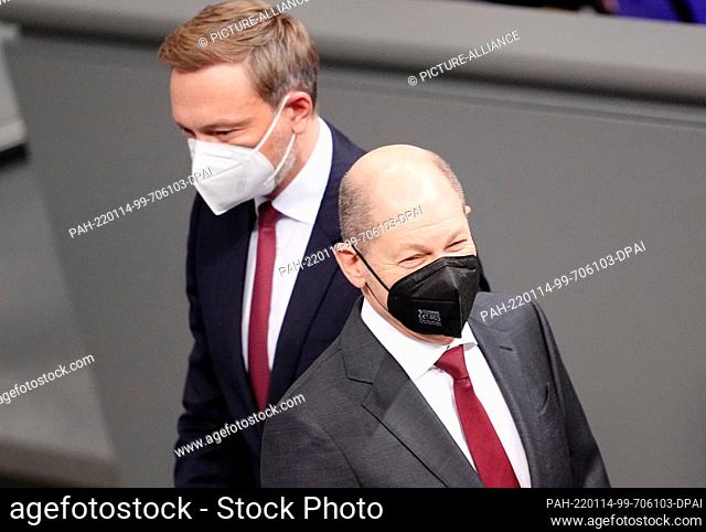 14 January 2022, Berlin: Christian Lindner (FDP), Federal Minister of Finance, and Chancellor Olaf Scholz (SPD) attend the session of the Bundestag