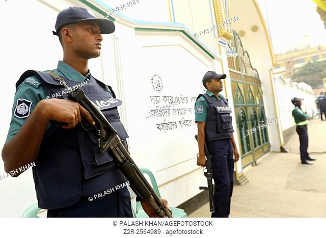 Bangladeshi policemen stand guard in front of a Shia mosque in Dhaka, Bangladesh 27 November 2015. Security has been beeped up after three gunmen attack and...