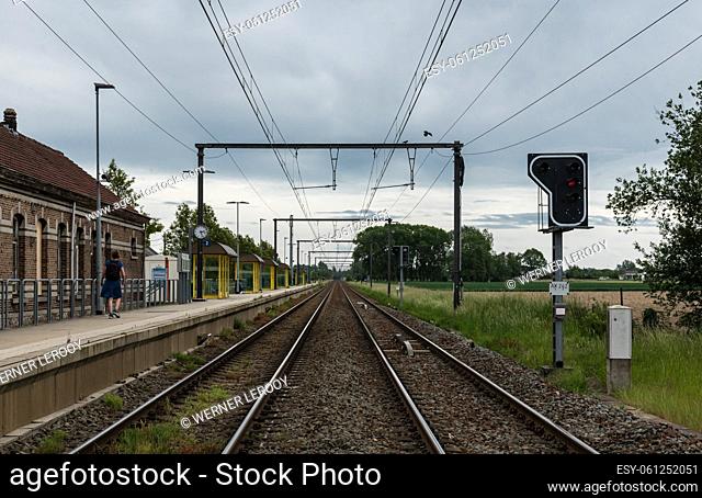 Heizijde, Flanders Belgium - 05 25 2020 Empty railway tracks and platform of the Heizijde station at the Belgian countryside