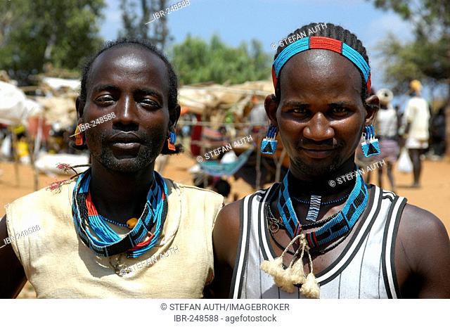 Two men with colourful adornment market of Keyafer Ethiopia