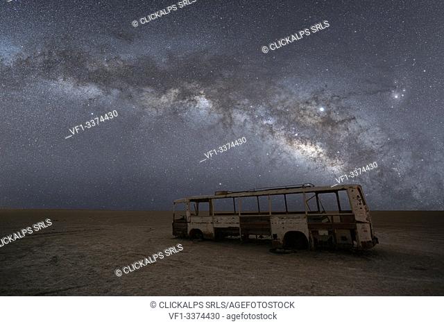 the Milky way over bus wreck in the desert of salt, Chott el-Jérid, Tunisia, Northern Africa