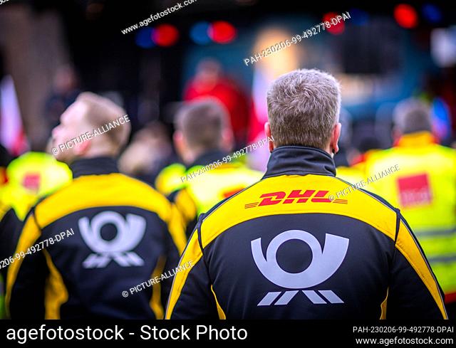 06 February 2023, Mecklenburg-Western Pomerania, Rostock: Employees of Deutsche Post take part in a protest rally during the nationwide warning strike at...