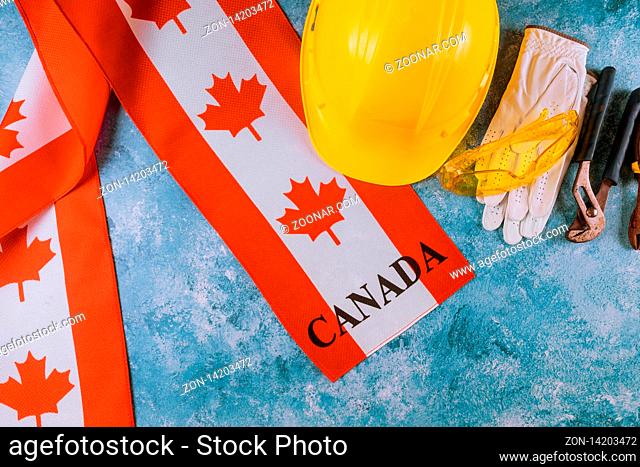 Canada happy labor day greeting card in the grunge and yellow helmet abstract image