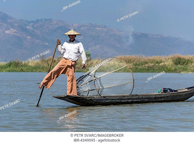 Leg-rowing Intha fisherman with boat on Inle Lake, Burma, Myanmar