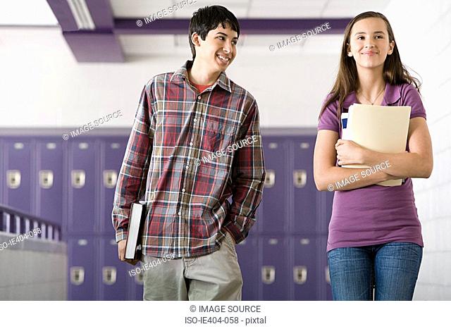 High school students walking down a corridor