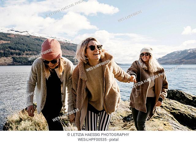 UK, Scotland, happy female friends at Loch Lomond