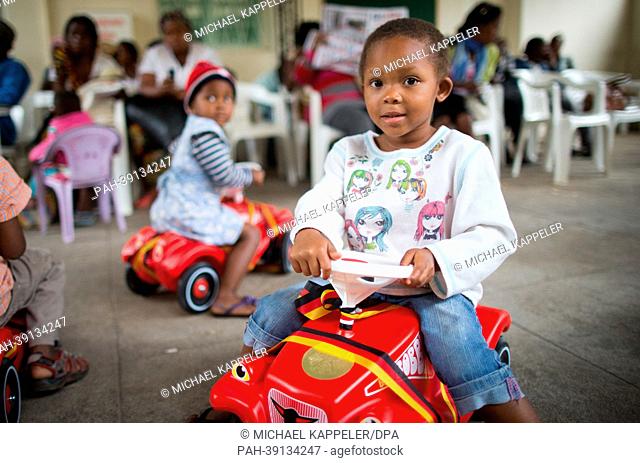 Children drive Bobbycars donated during the visit of German Minister of Foreign Affairs Guido Westerwelle in Maputo, Mozambique, 30 April 2013