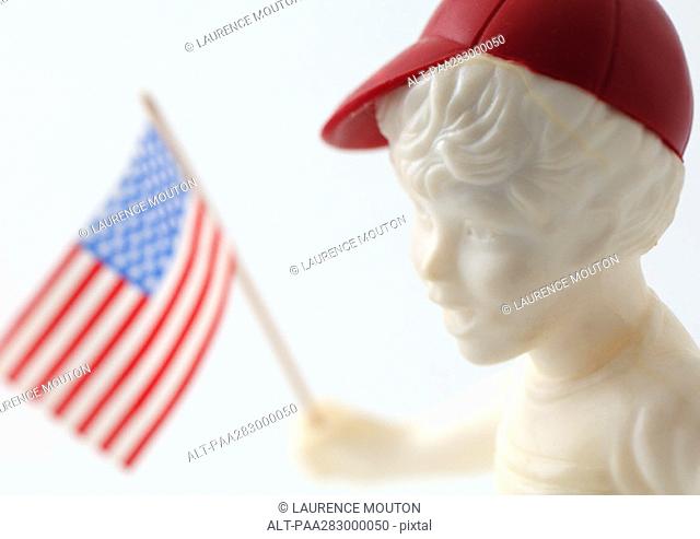 Boy figure holding American flag