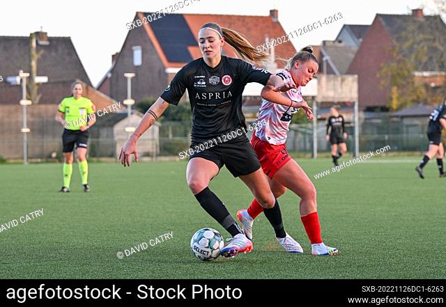 Marie Bougard (10) of Woluwe pictured fighting for the ball with Imani Prez (11) of Zulte-Waregem during a female soccer game between SV Zulte - Waregem and WS...