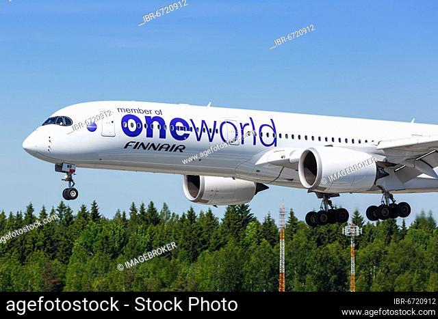 A Finnair Airbus A350-900 with the registration OH-LWB in the OneWorld special livery lands at Helsinki Airport, Finland, Europe
