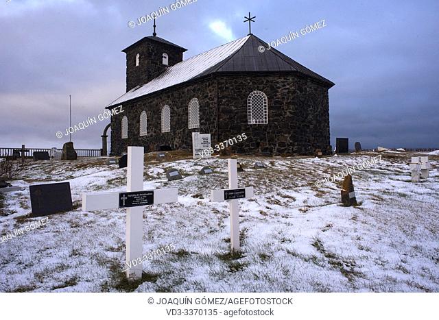 Stone church and its cemetery in Pingeyrar on the Hop lake (Iceland)
