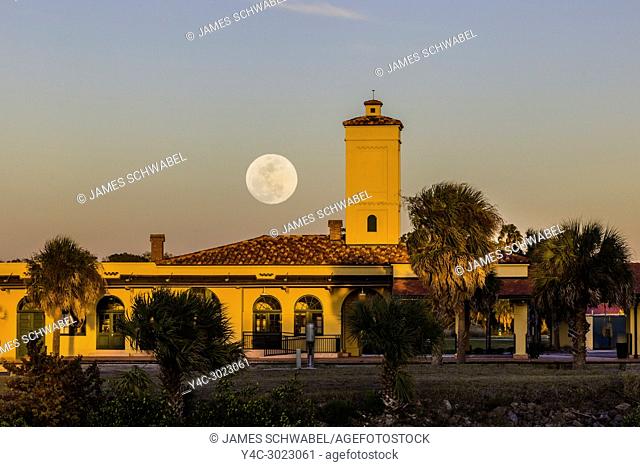 Moon coming up over historic Venice Seaboard Air Line Railway Station also known as the Venice Train Depot in Venice, Florida, United States