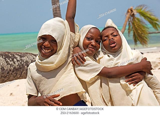 Young muslim girls with headscarf on Jambiani beach, Zanzibar Island, Tanzania, East Africa
