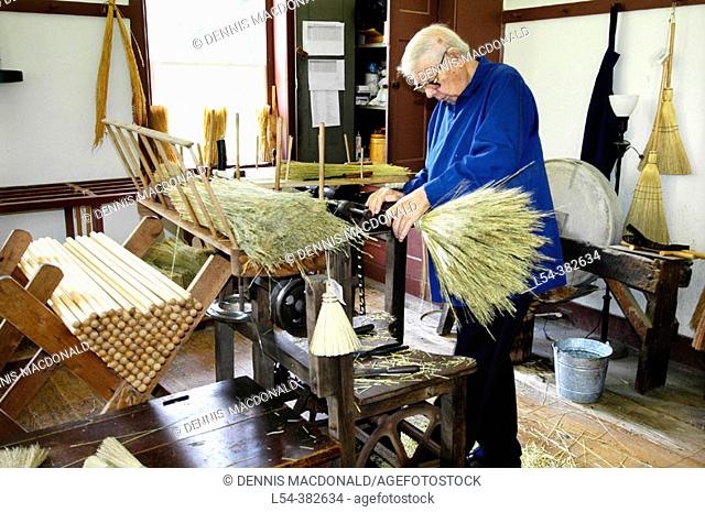 Making brooms for sale from special local straw at Historic Shaker Village of Pleasant Hill Kentucky KY
