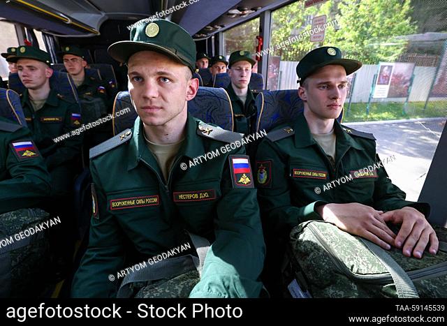 RUSSIA, MOSCOW REGION - MAY 17, 2023: Track cycling and canoeing title holders Dmitry Nesterov and Savely Sidorov (L-R front) respectively board a bus at an...