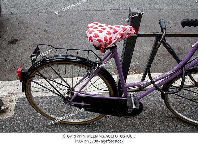bike with red love hearts saddle in road street in rome italy