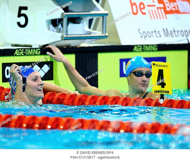 Jazmin Carlin of Great Britain (L) and Mireia Garcia Belmonte of Spain react after the women's 800m Freestyle Finals at the 32nd LEN European Swimming...