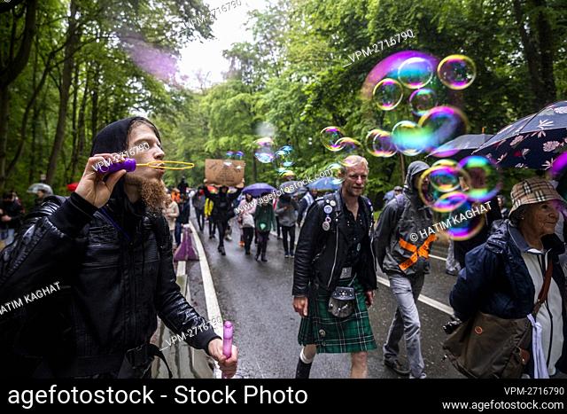 People attend the second edition of the 'World Wide Demonstration for Freedom - Belgium' at the Bois de La Cambre - Ter Kamerenbos, in Brussels