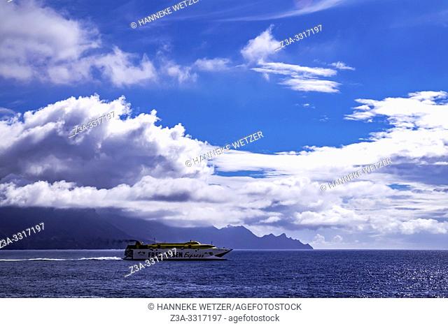 Ocean, ship and mountains seen from Agaeta, Gran Canaria